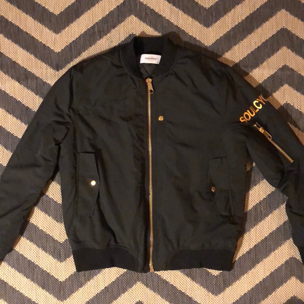 NEW SOULCYCLE bomber w/ gold zip & wheel on back
